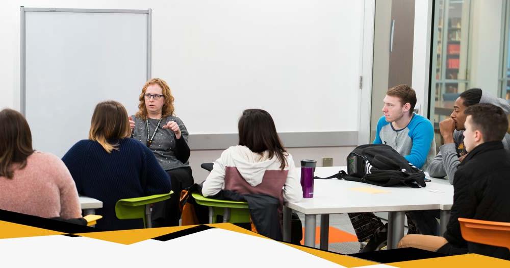 Students work together under guidance of MU instructor within the classroom